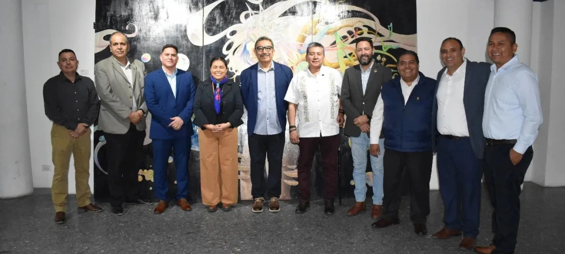 Group of people in front of an art piece